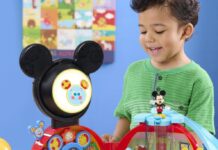 Child playing with a Mickey Mouse Clubhouse play set