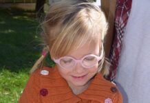 A child holding a woolly bear caterpillar