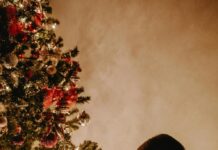 Child writing in a holiday wish list