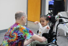 The Do’s and Don’ts of Inclusivity A child and a volunteer at Ryan's Place