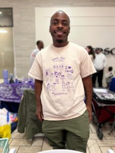 CASA at Sheridan School's camp director Key Lucas wears a shirt students designed as part of the camp in 2024.