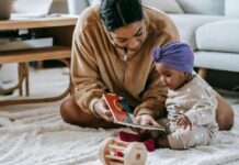 A mother reading to a baby