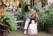 We Love It! Tetris, Travel Toys and More A mother with a baby and a pink Jool Baby relay diaper bag backpack