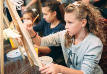 group lesson in drawing. Children learn to draw in the classroom.