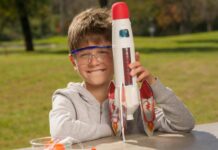 A boy holding a rocket