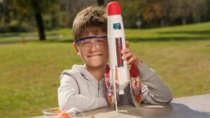 A boy holding a rocket