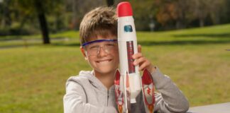 A boy holding a rocket