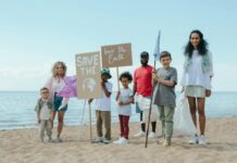 Weekend Fun in the DMV: April 18-19 A group of kids on the beach holding signs that say "Save the Earth" and "Love the Earth"