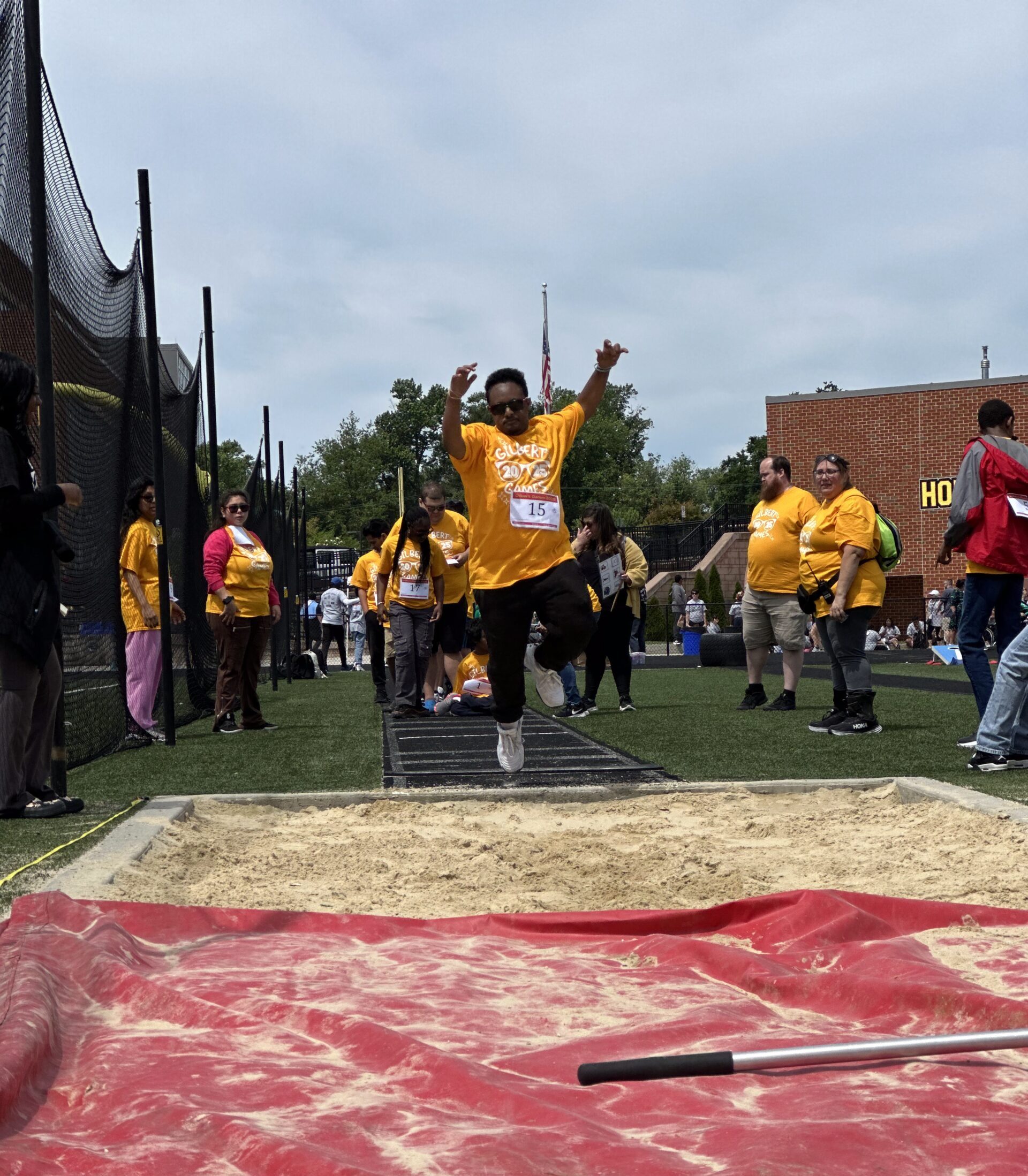 Students doing a long jump 