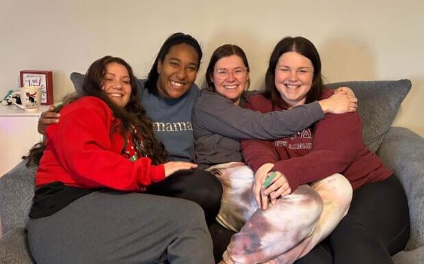 Four women on a couch