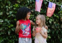 Explore These DMV Events This Weekend: June 5-7 Two girls standing by American flags