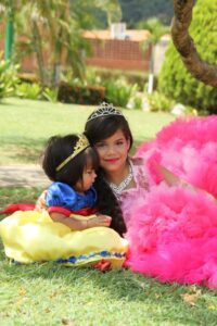 Two girls dressed as princesses