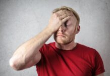 Dad’s Health Key to Healthy Kids and Families Man putting a hand on his forehead