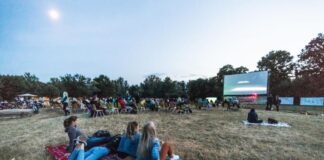 People watching a movie outside