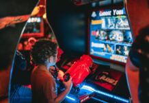 A child playing an arcade game