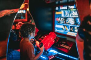 A child playing an arcade game