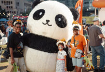 Check Out These DMV Events This Weekend: Aug. 14-16 A family poses with a person in a large panda costume