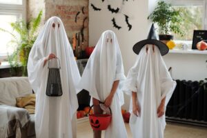 Kids dressed as ghosts for Halloween